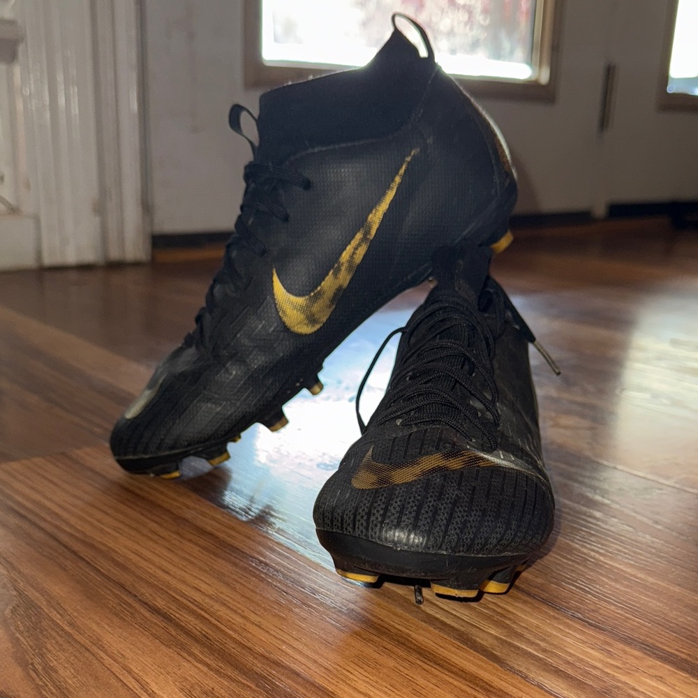 Nike Black and Gold High-Top Cleats